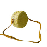 Side view natural Ava Raffia Style Round Bag